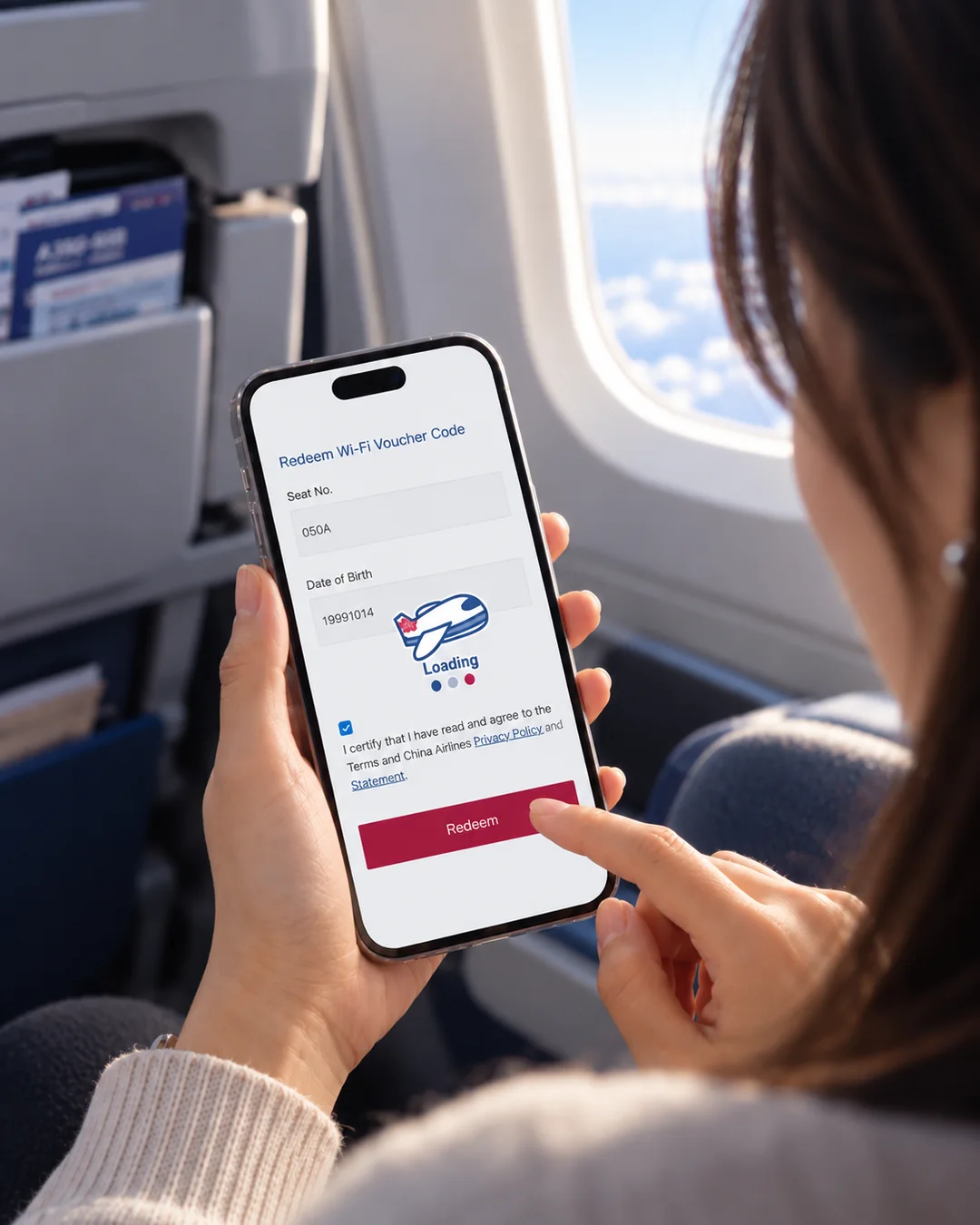 A passenger on board redeeming a China Airlines in-flight Wi-Fi voucher on her phone.